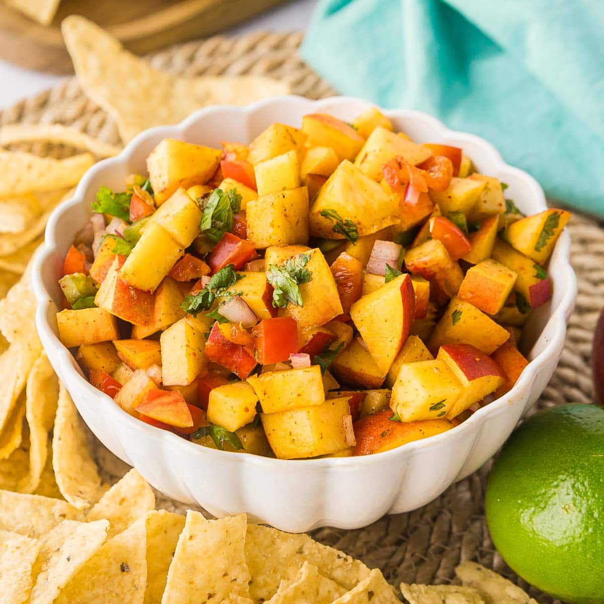 Close up of homemade peach salsa in a bowl.