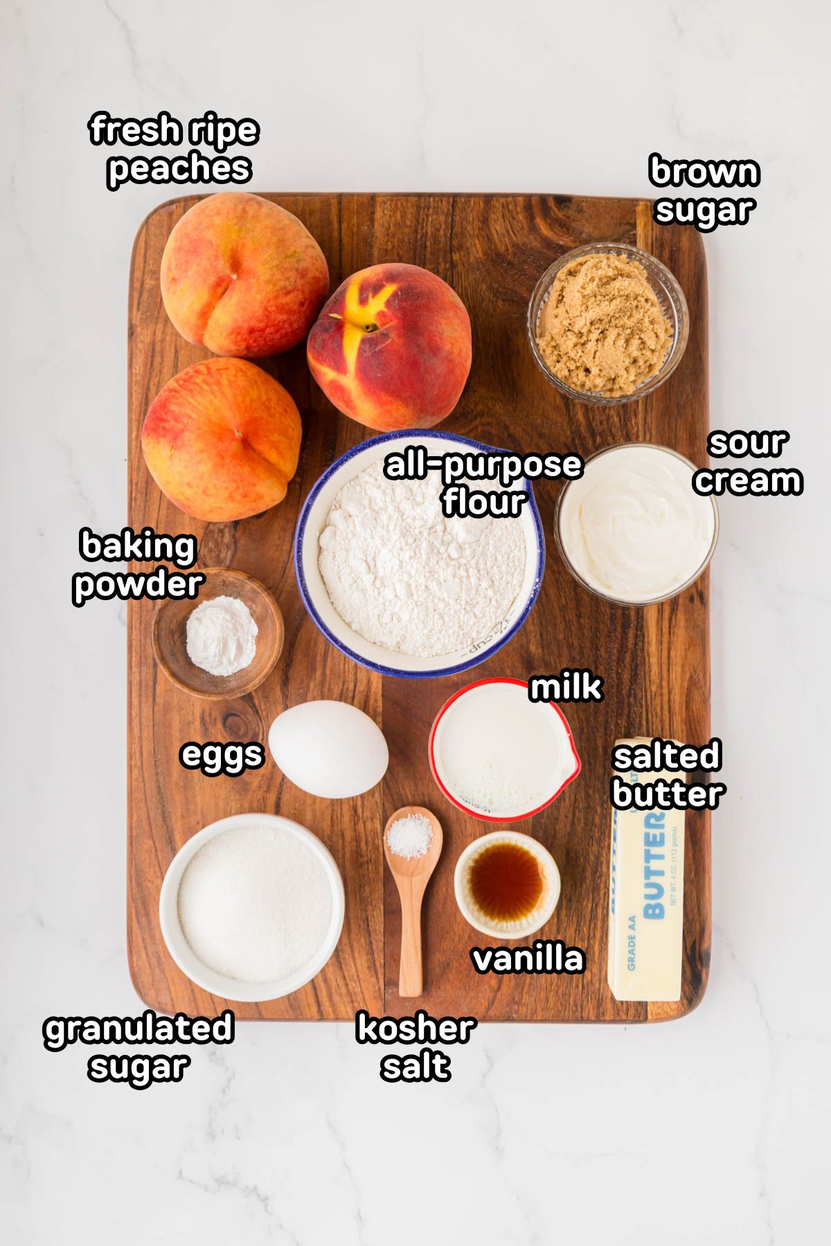 A labeled image of ingredients needed to make peach upside down cake.