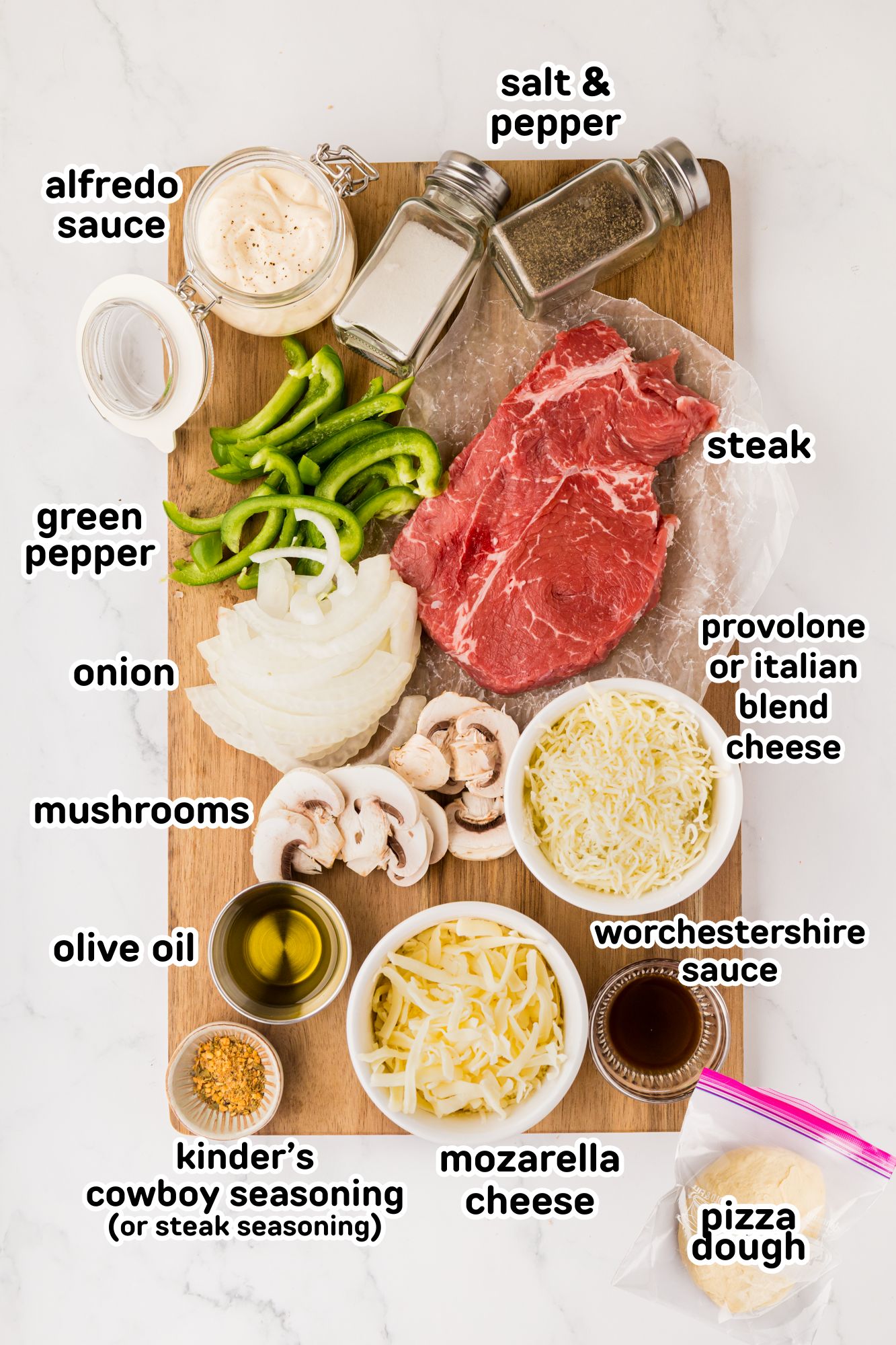 Labeled ingredients needed to make a Philly cheesesteak pizza.