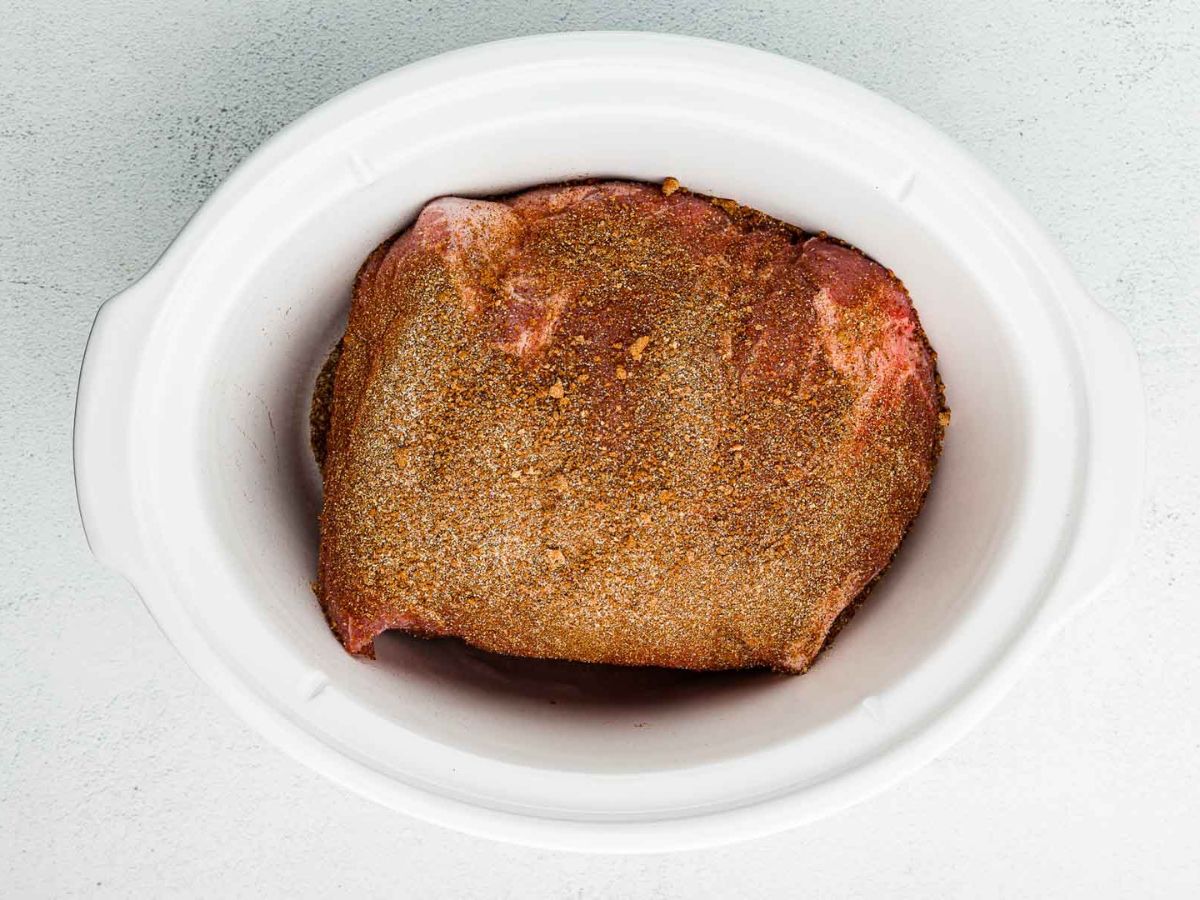 Seasoned pork butt in the slow cooker.
