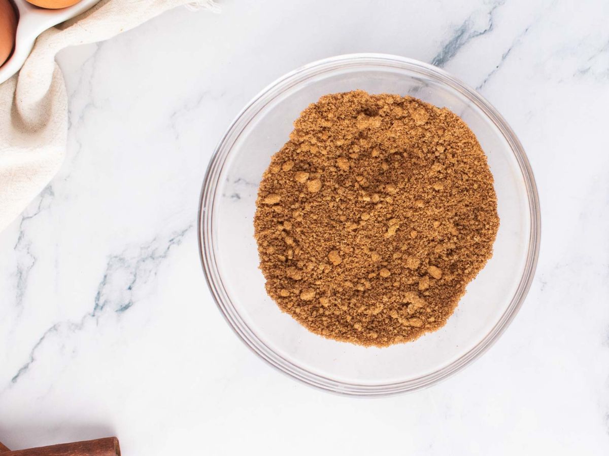 Cinnamon mixed with brown sugar in a glass bowl.