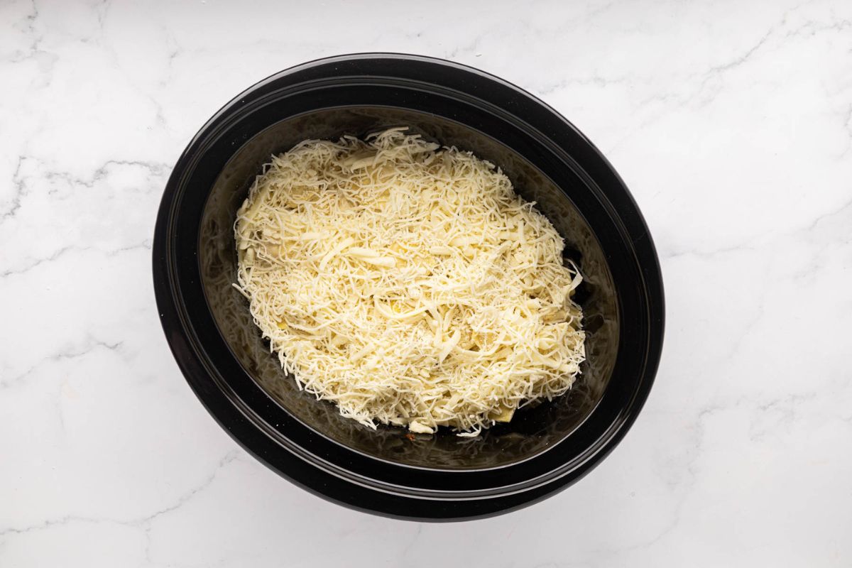 Second layer of cheese on top of ravioli. 