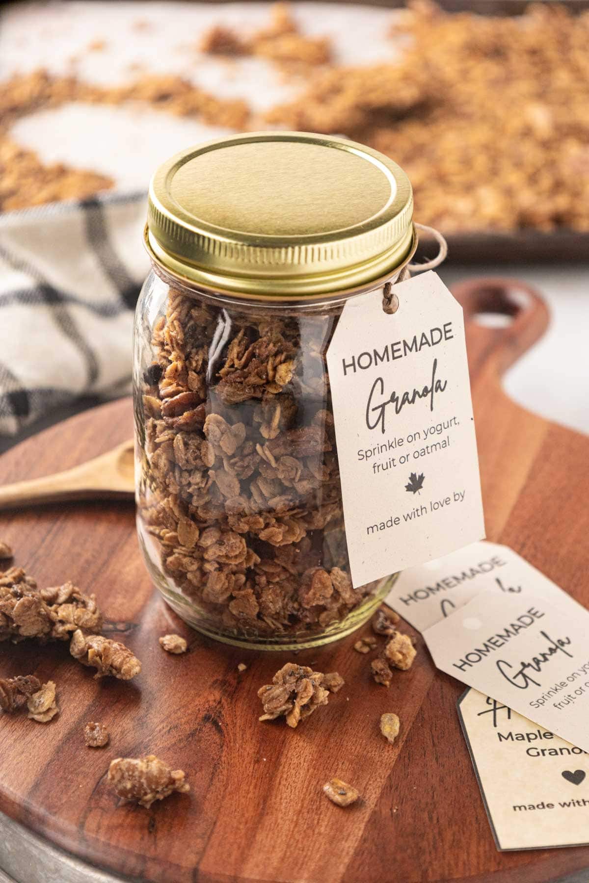 Maple pecan granola stored in a mason jar labeled with a printable gift tag.