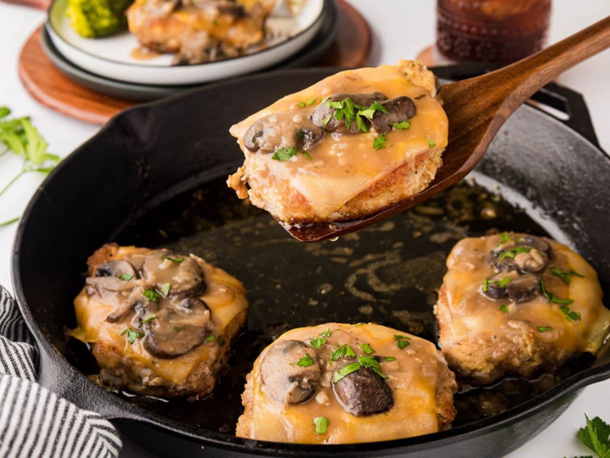 A cast-iron skillet with fontina pork chops.