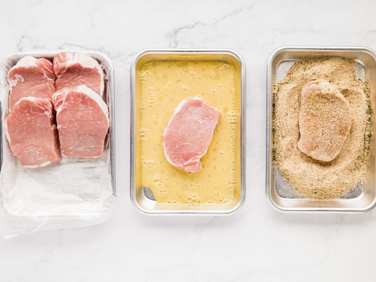 Dipping pork chops and egg wash and then breadcrumbs.