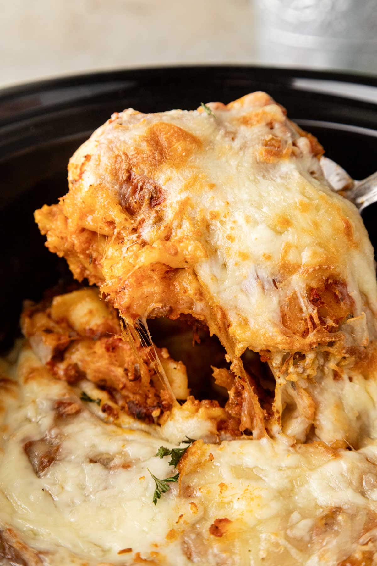 Scooping out a serving from the slow cooker.