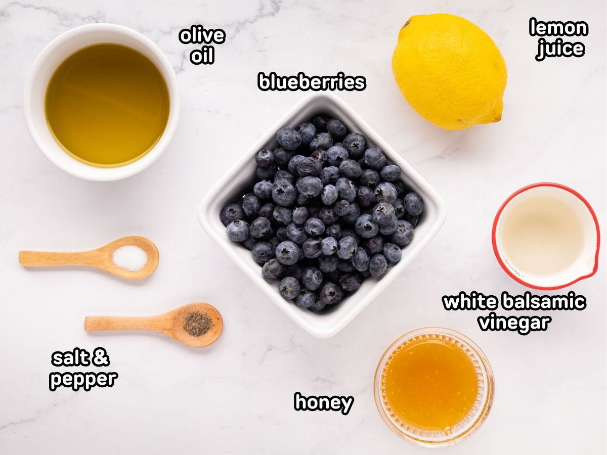 A labeled image of ingredients needed to make blueberry vinaigrette dressing.