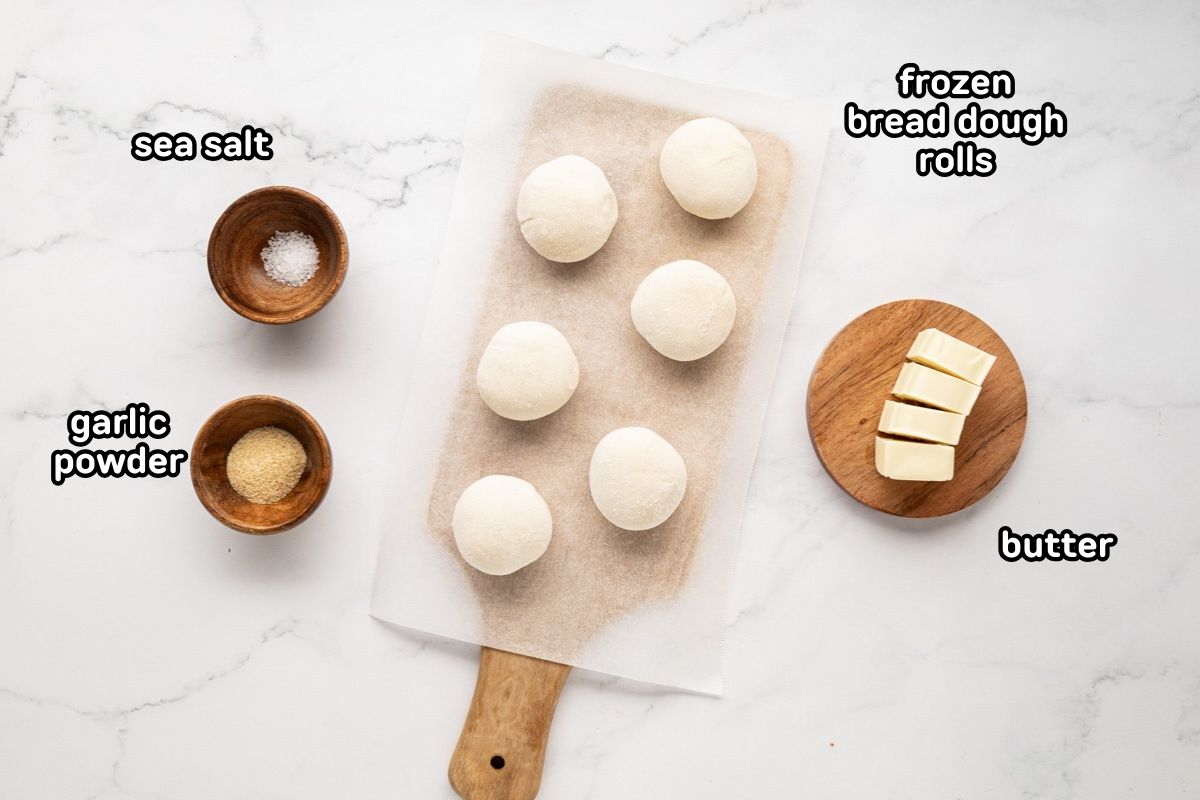 A labeled image of ingredients needed to make garlic breadsticks with frozen bread dough.