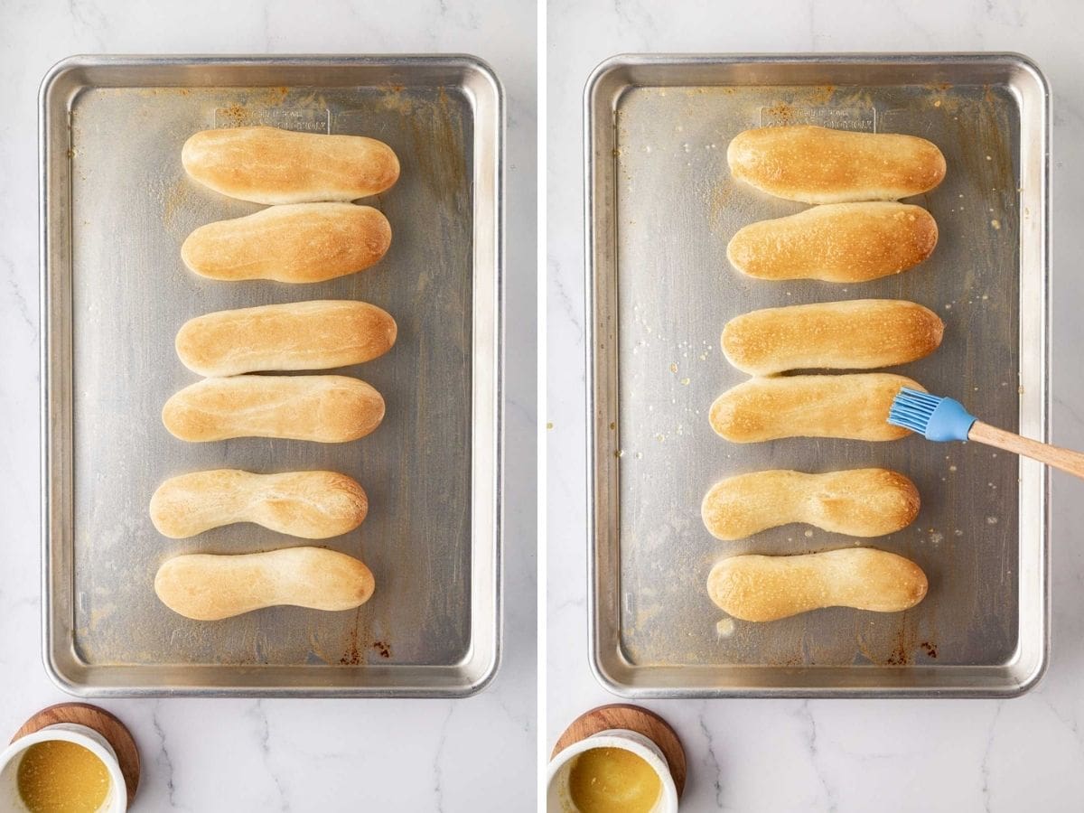 Spreading garlic butter on breadsticks with a brush.