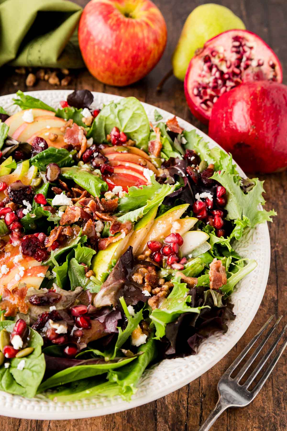 A white bowl filled with salad.