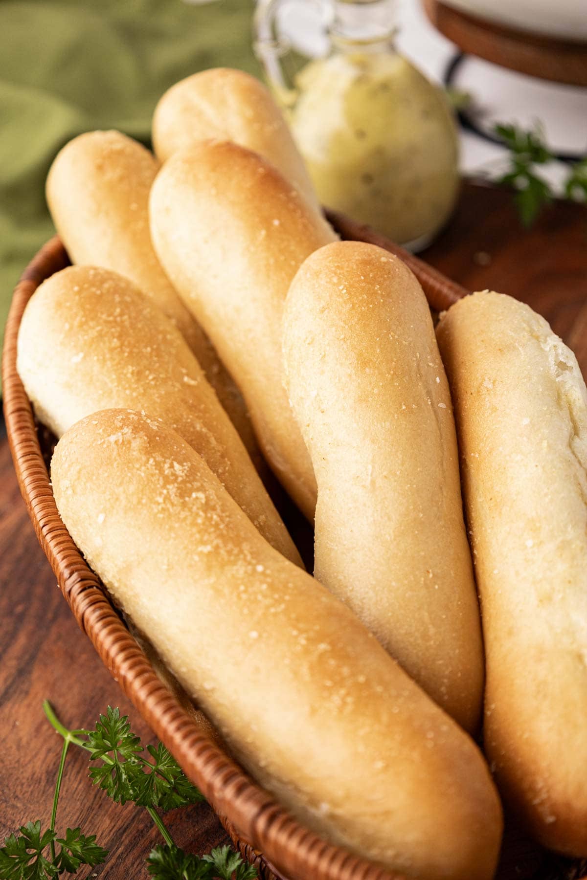 Breadsticks in a bread basket.