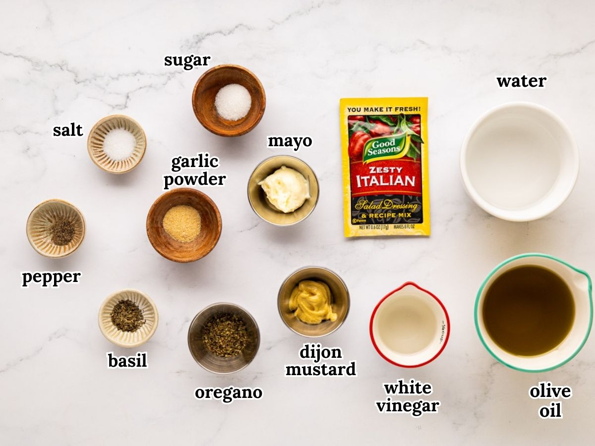 Labeled ingredients needed to make a copycat olive garden salad dressing.