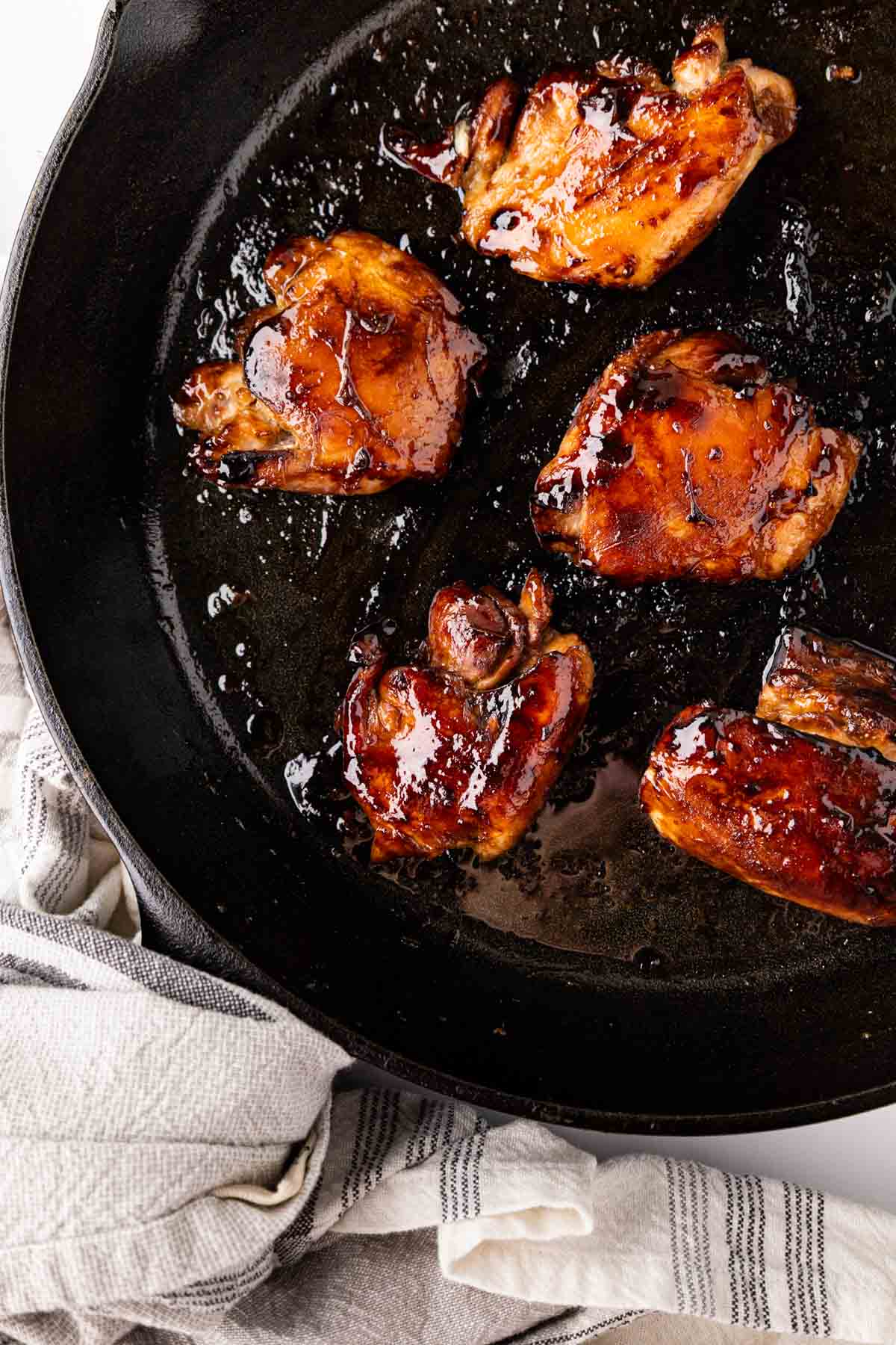 Teriyaki chicken and a cast-iron skillet.