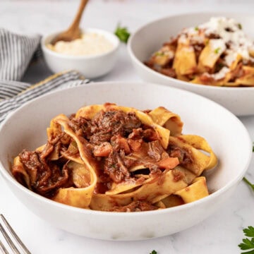 A serving of beef ragu with Pappardelle pasta.