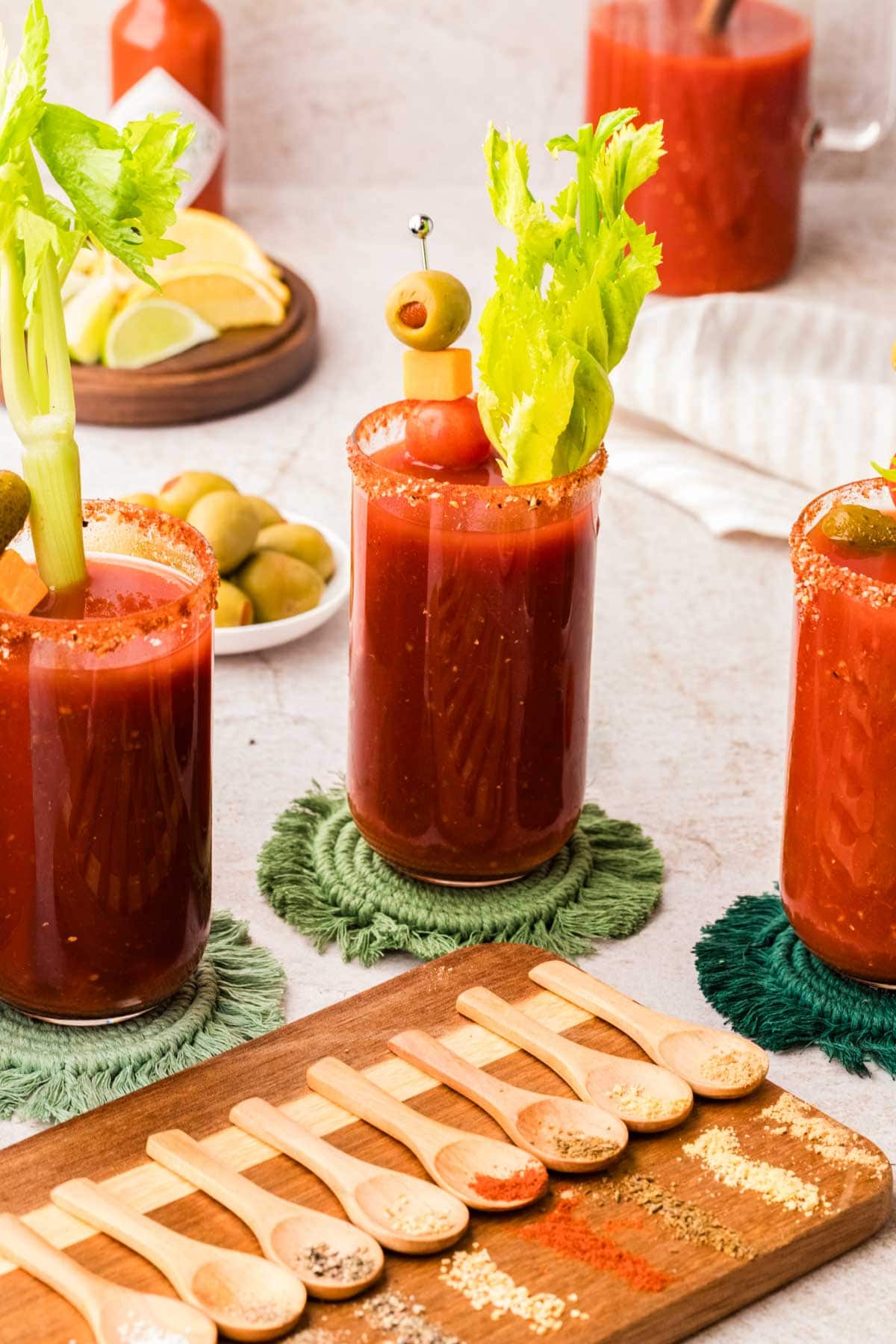 Bloody Marys in glasses rimmed with homemade bloody mary rim salt.