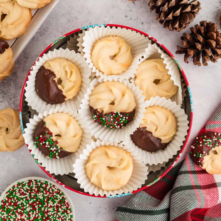 Danish butter cookies stacked in a Christmas cookie tin.