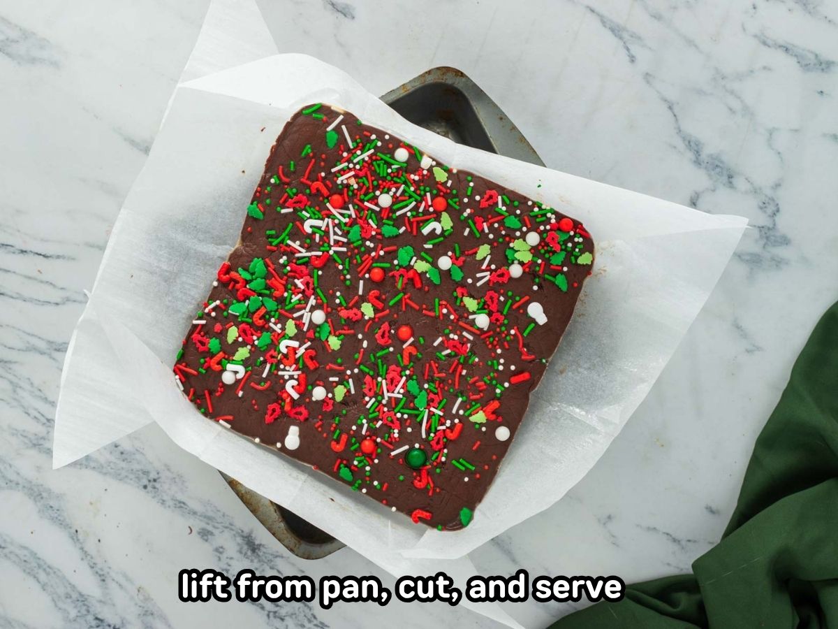 Christmas fudge pulled from the pan using the parchment paper.
