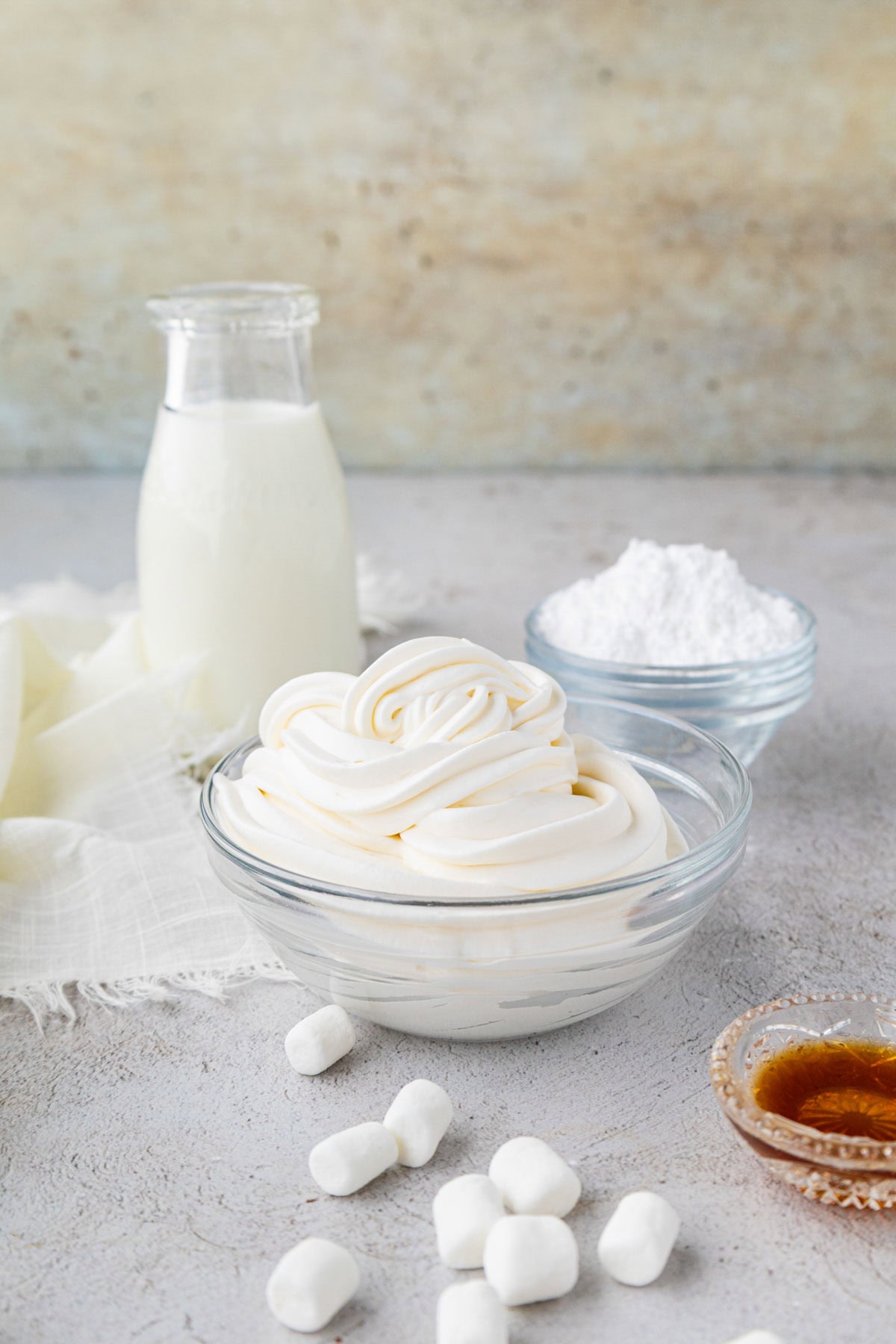 Marshmallow whipped cream in a clear bowl.