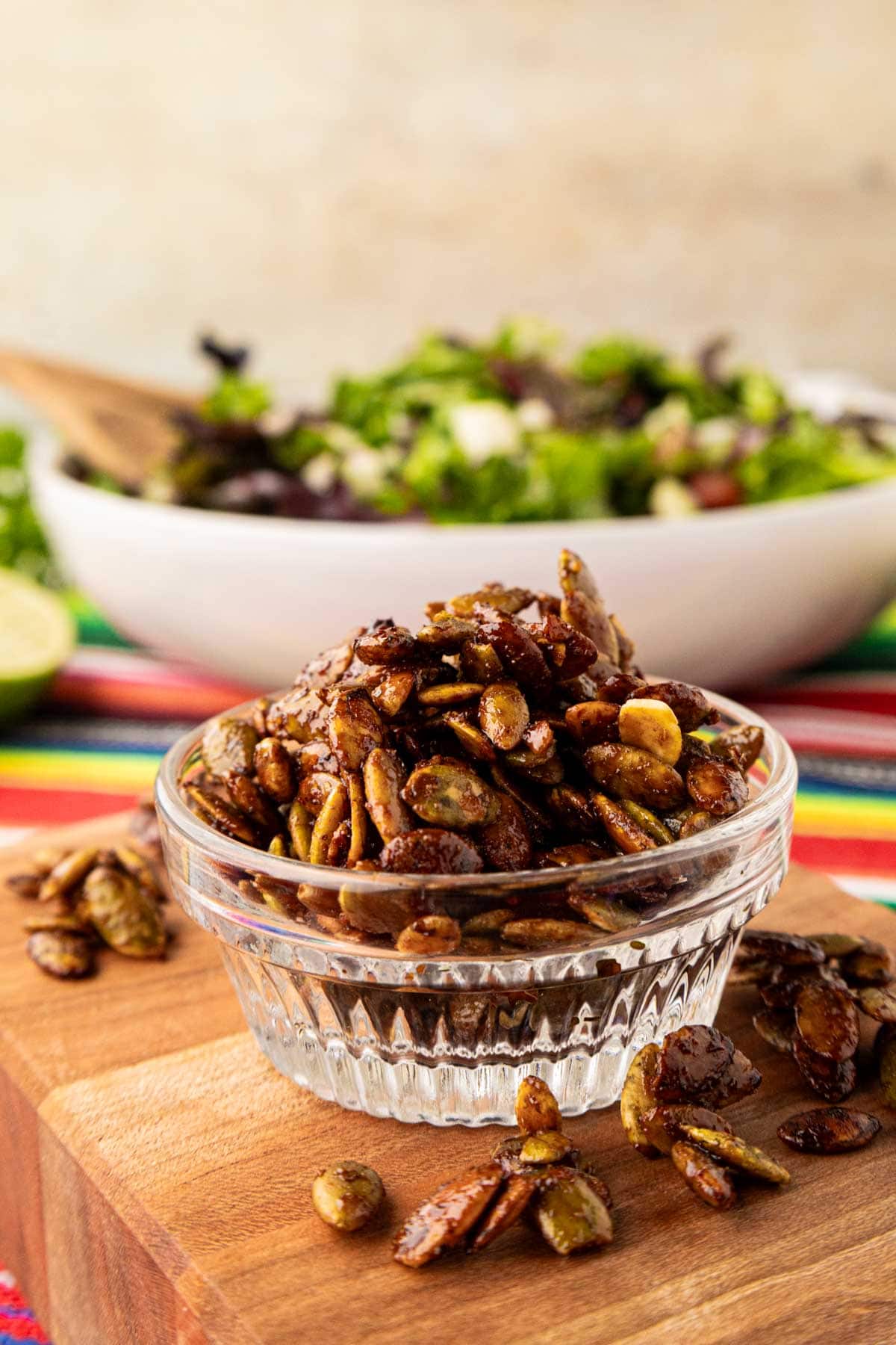 Spiced pepitas in a clear crystal bowl.