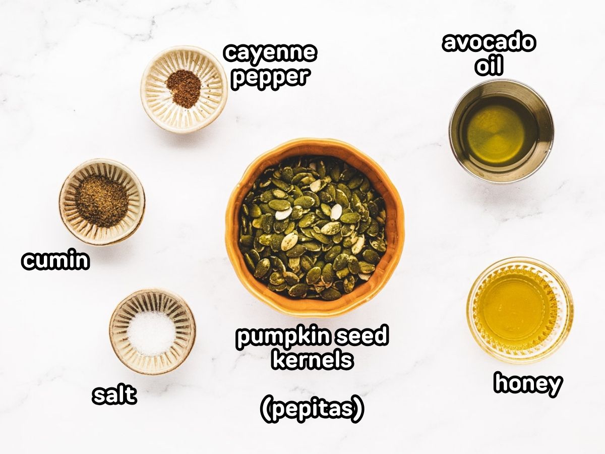 A labeled image of ingredients needed for spicy roasted pumpkin seed kernels.