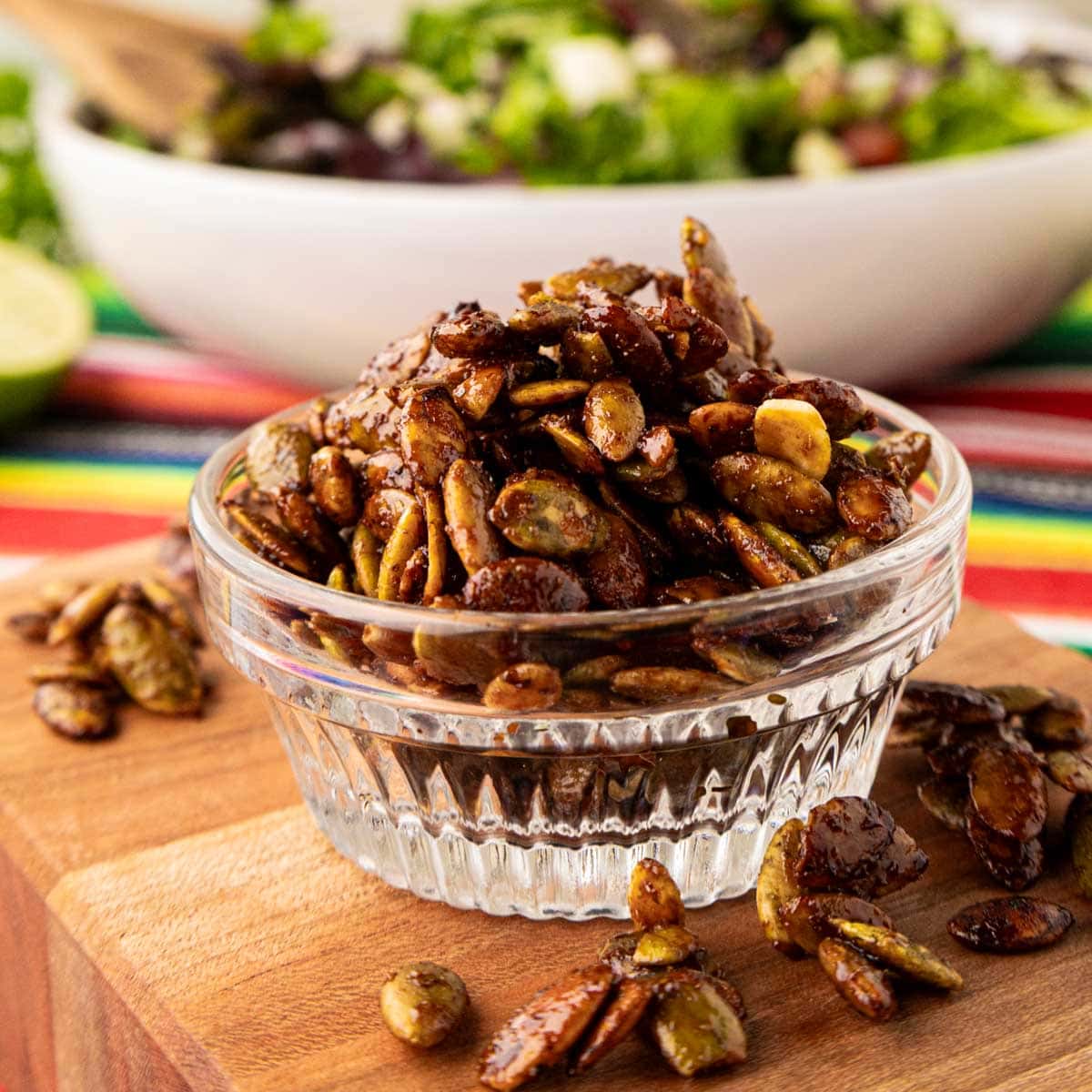 Spiced pepitas in a clear crystal bowl.