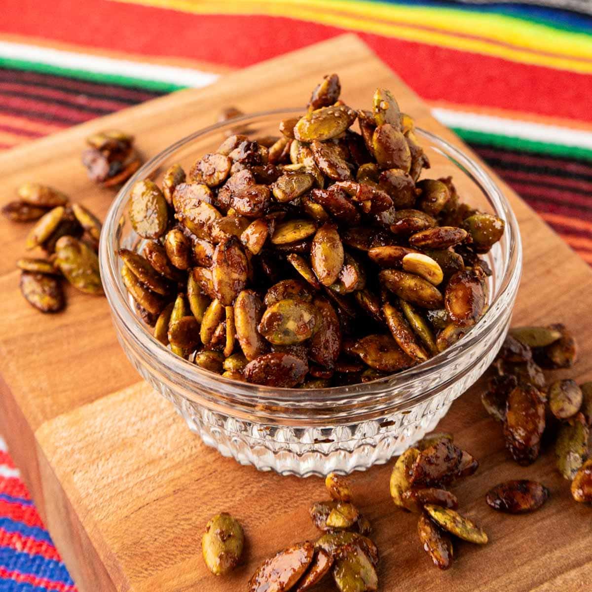 Roasted pumpkin seed in a glass bowl.