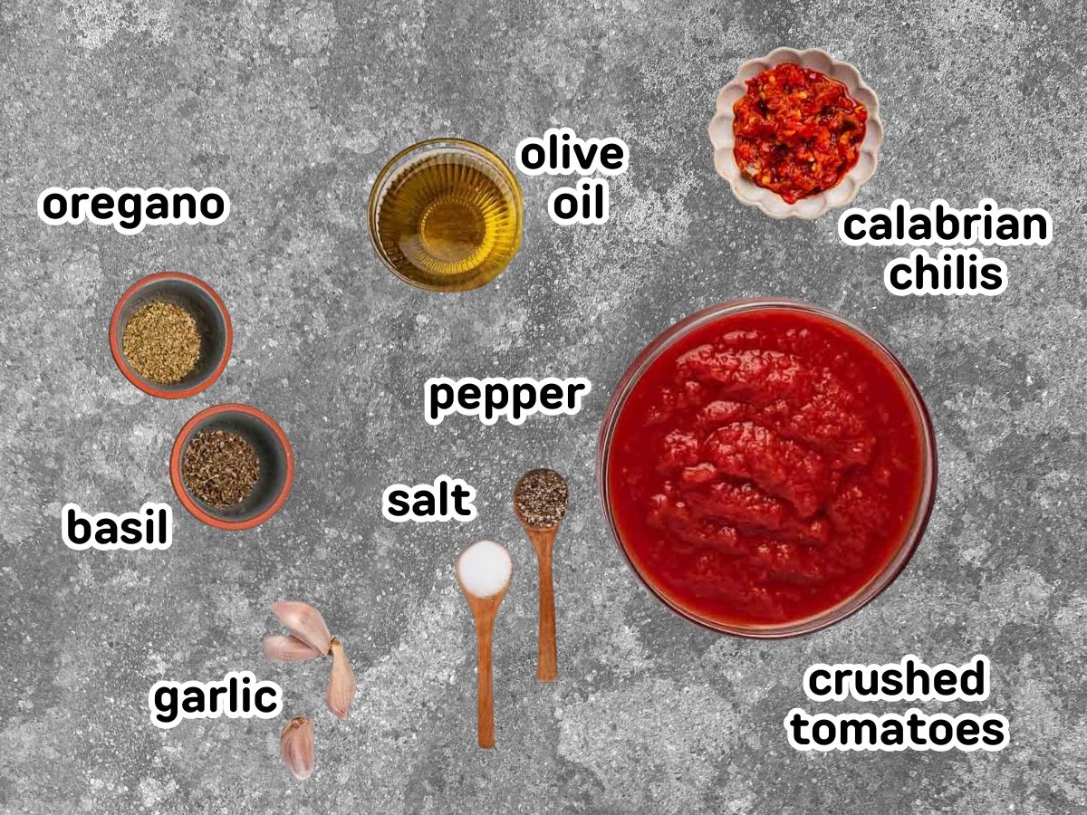 Labeled ingredients needed to make Calabrian marinara sauce.
