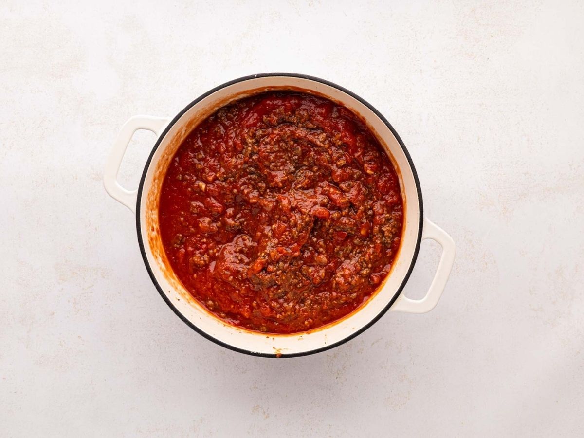 Meat sauce, and a white Dutch oven.