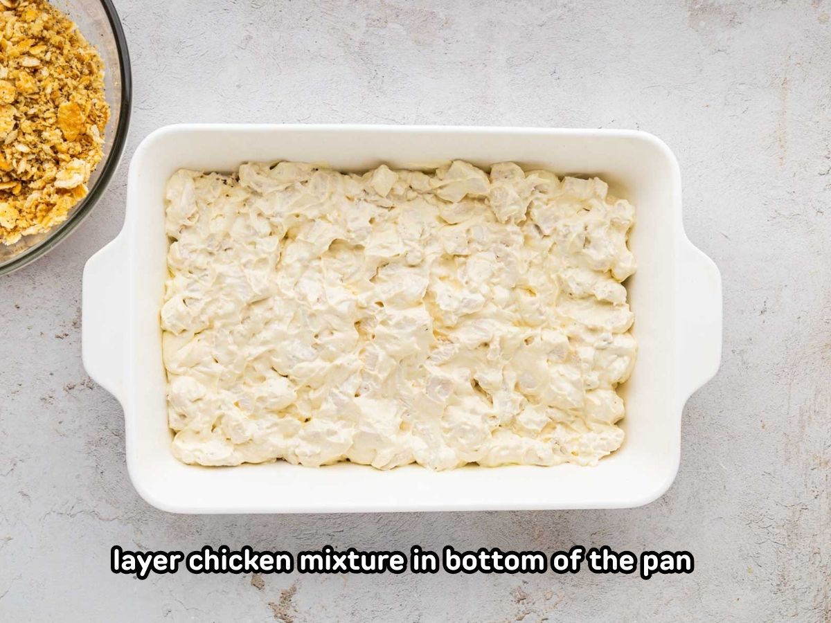 Creamy chicken mixture in the bottom of the 9 x 13 dish.