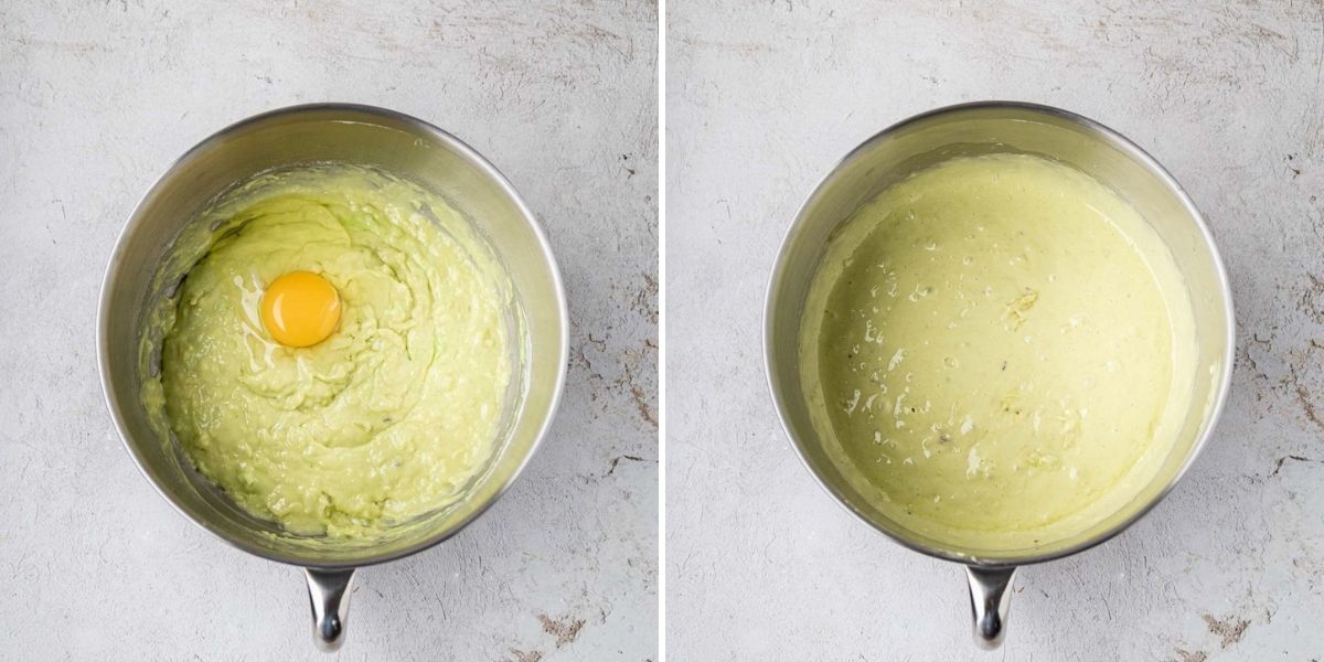 Eggs added to the cake batter mixture in the bowl of a stand mixer.