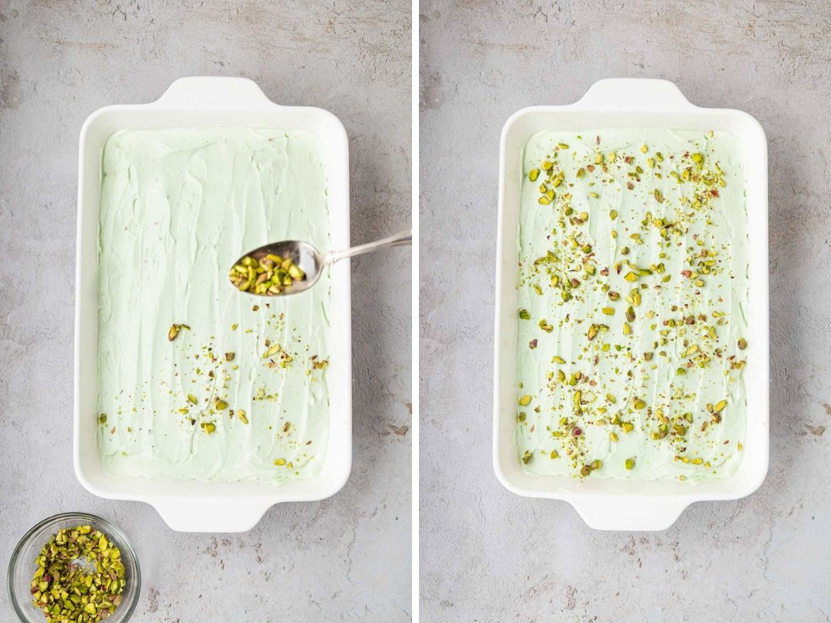 Sprinkling crushed pistachios on top of the iced cake.