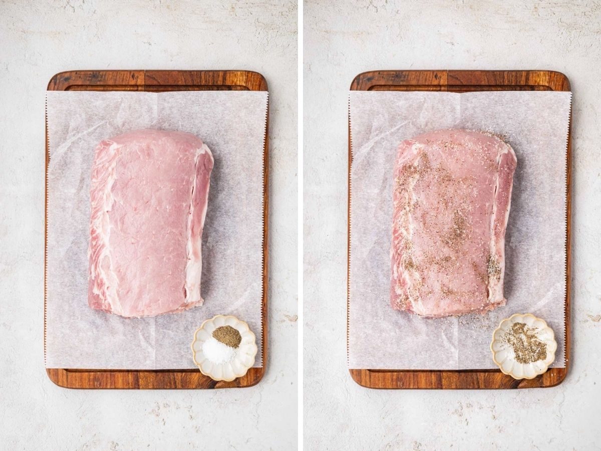A pork roast had a dry on a cutting board and then seasoned with salt and pepper.
