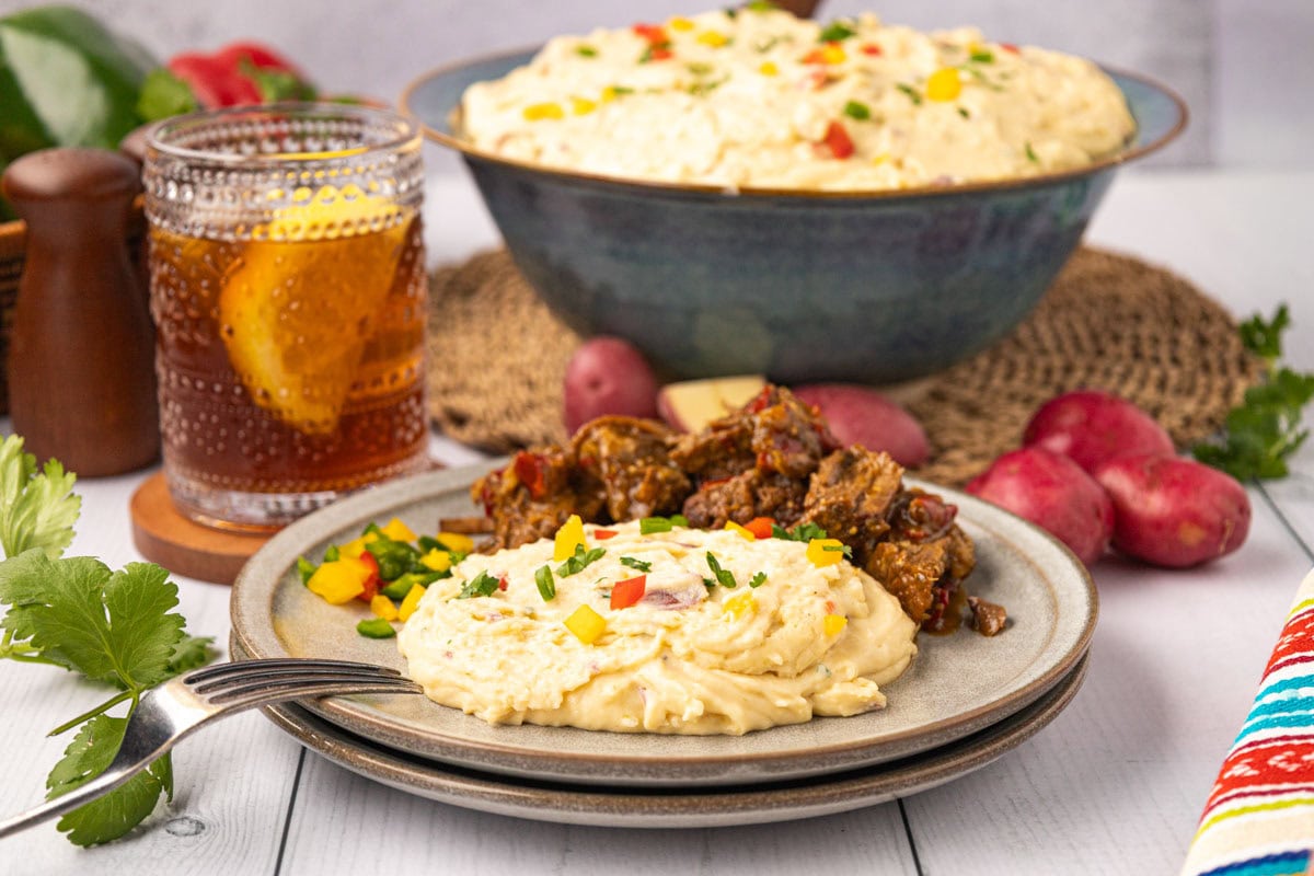 Tex-Mex Mashed potatoes on a plate with mexican pot roast.