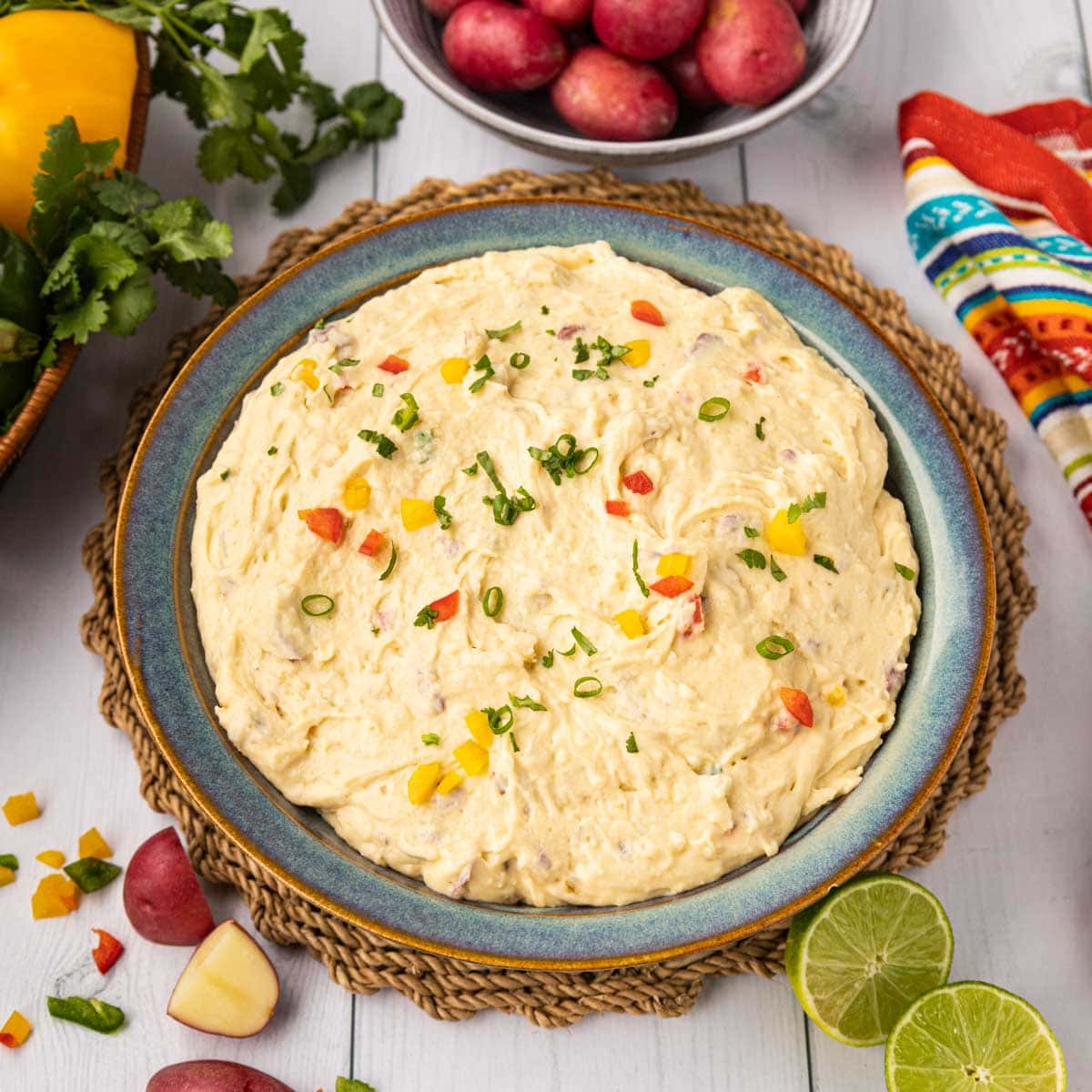 Mexican mashed potatoes in a blue bowl.