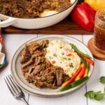 Mexican pot roast served with mashed potatoes and bell peppers.