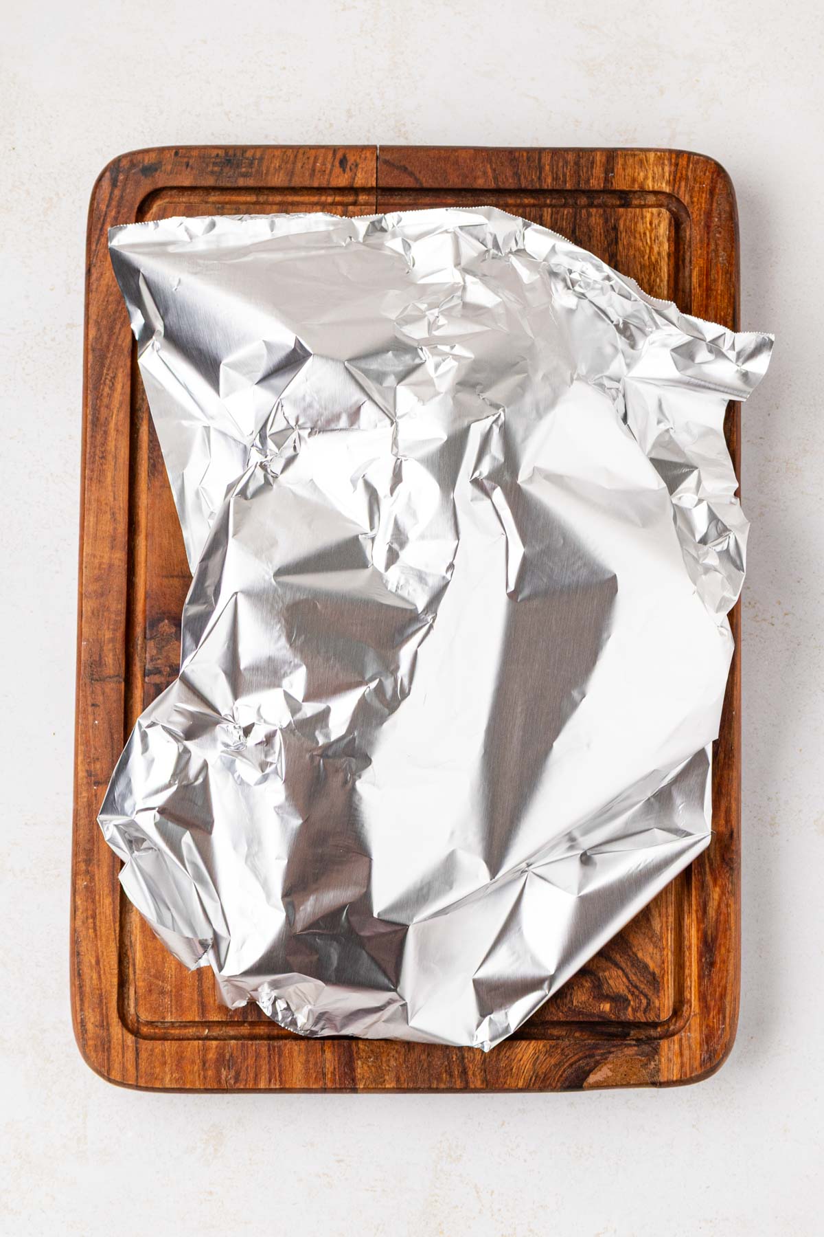 Pork loin roast tented with foil.