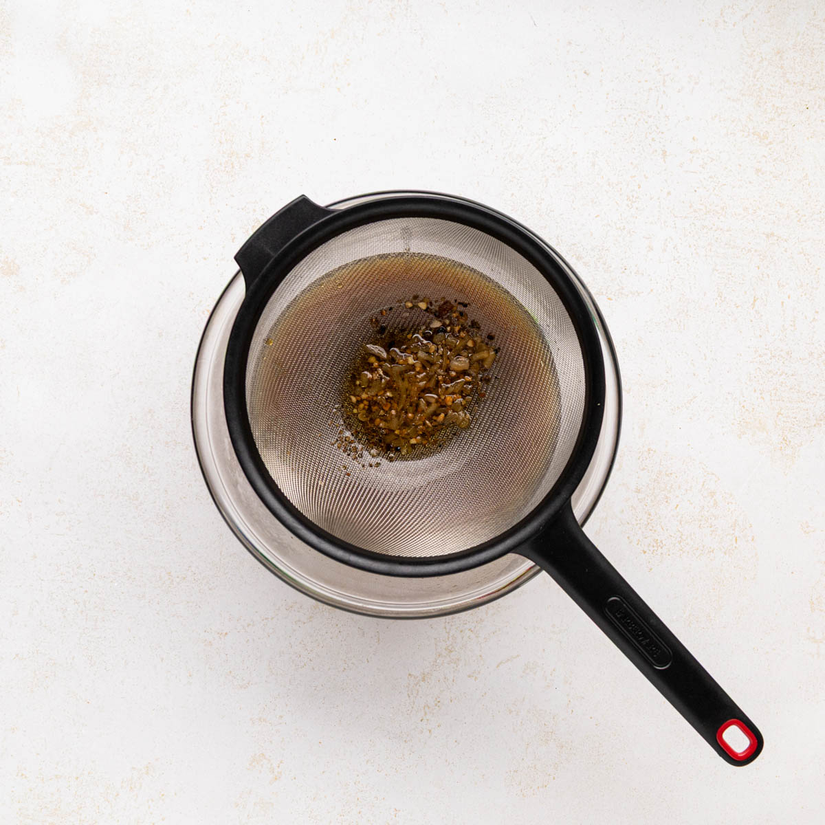 Pork drippings poured through a strainer.