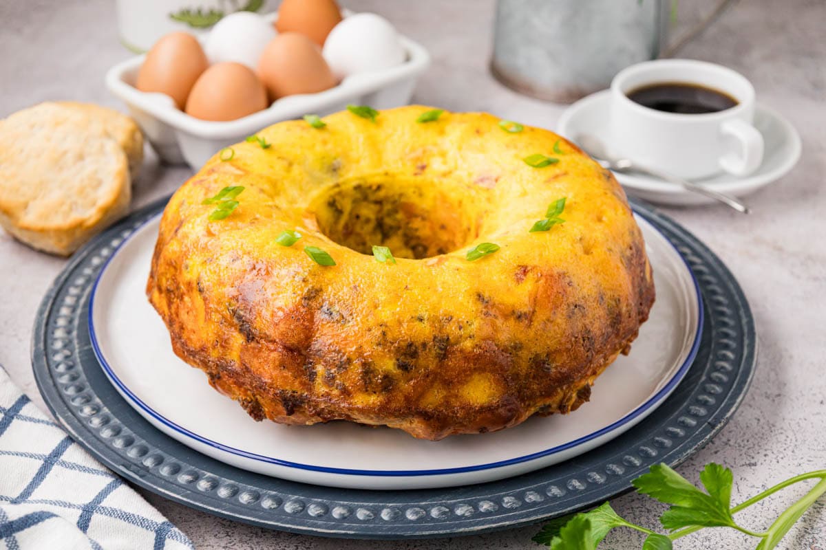 Breakfast casserole with biscuits turned out onto a plate.