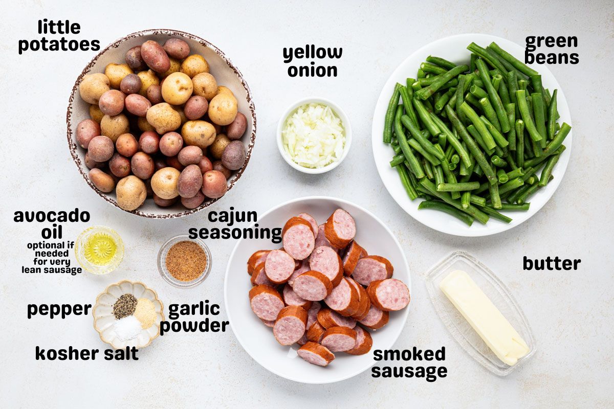 Ingredients needed to make crock pot sausage potatoes and green beans.