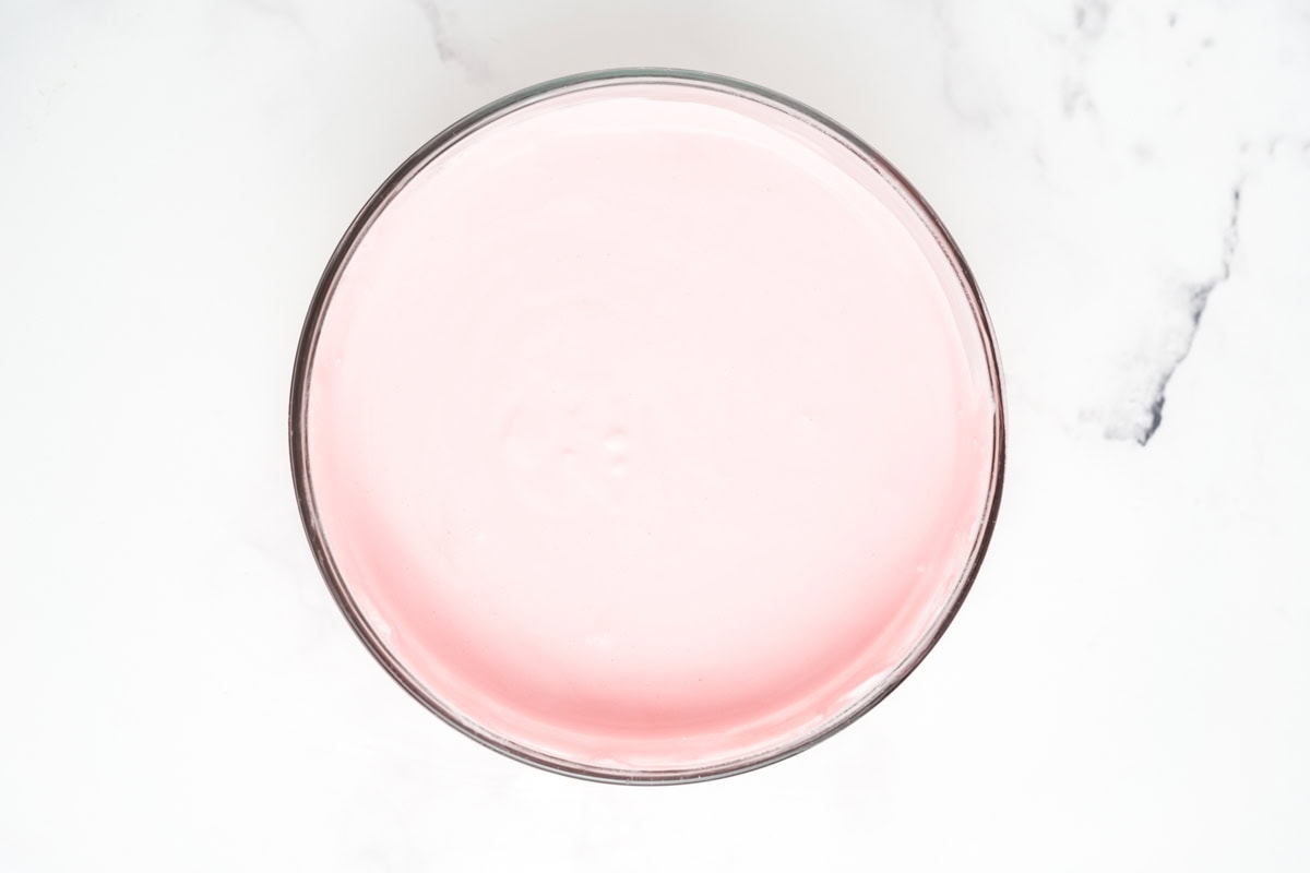 Thawed cool whip folded into the strawberry jello mixture.