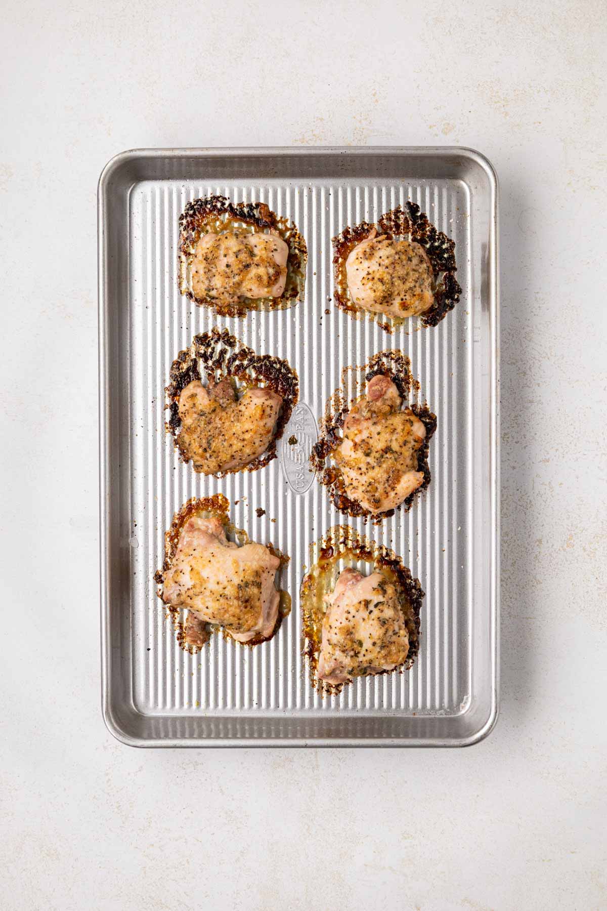 Baked Tuscan Chicken on a sheet pan.