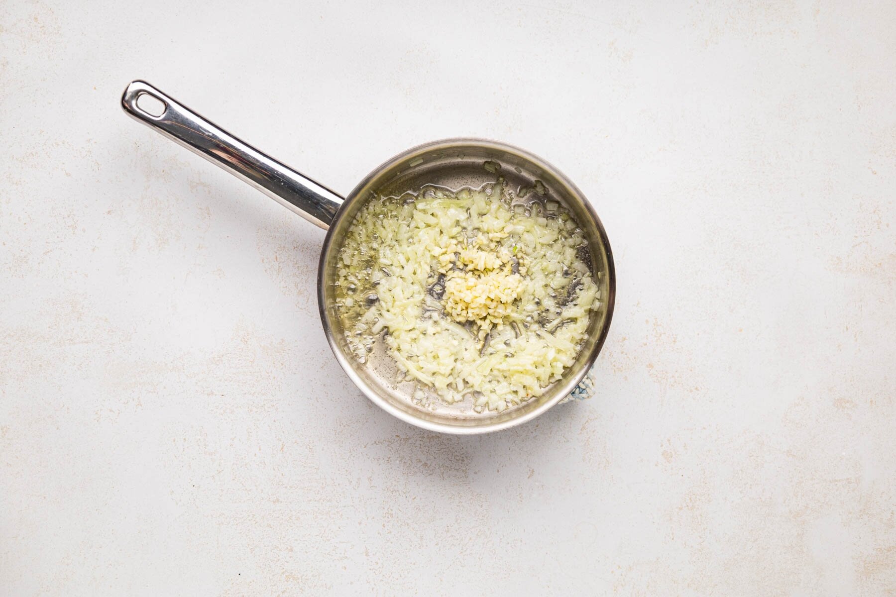 butter, onion, and garlic in a saucepan.