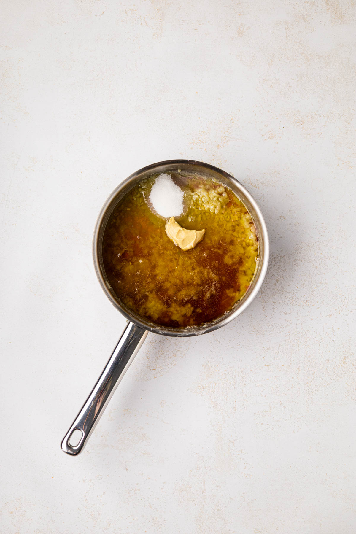 Oil, red wine vinegar, sugar and dijon added to rue.