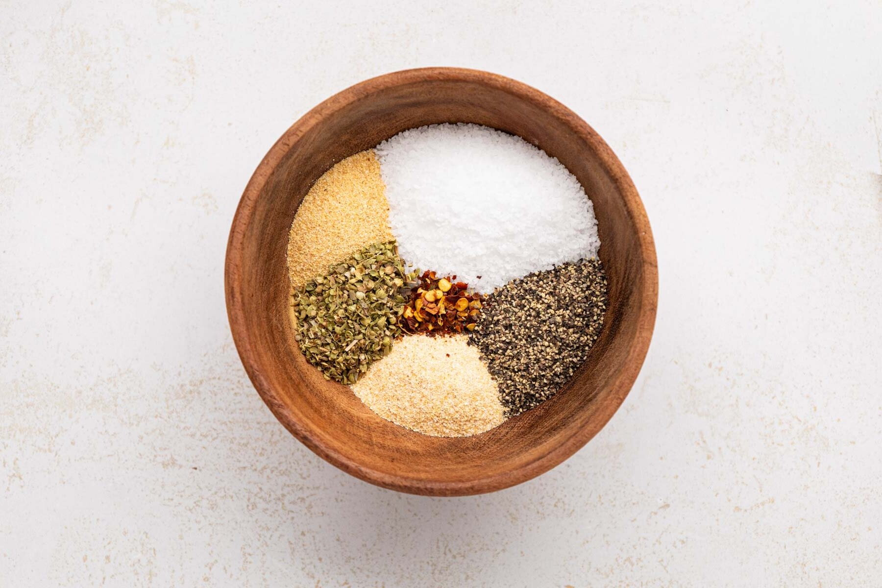 Seasonings and herbs in a bowl.