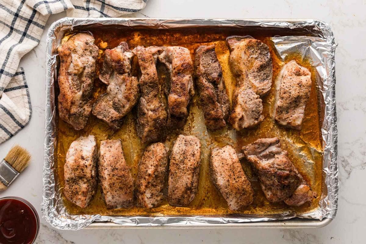 Ribs out of the oven after partial bake.