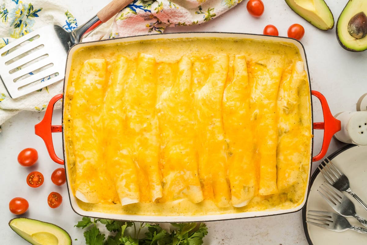 Finished and baked breakfast enchiladas in a baking dish.