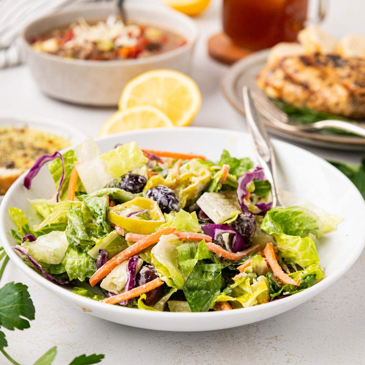 Copycat Carrabba's House Salad in a white bowl.