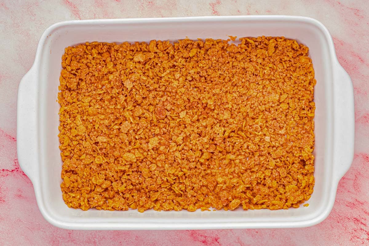 Cornflake crust in the bottom of a 9 X 13 baking dish.