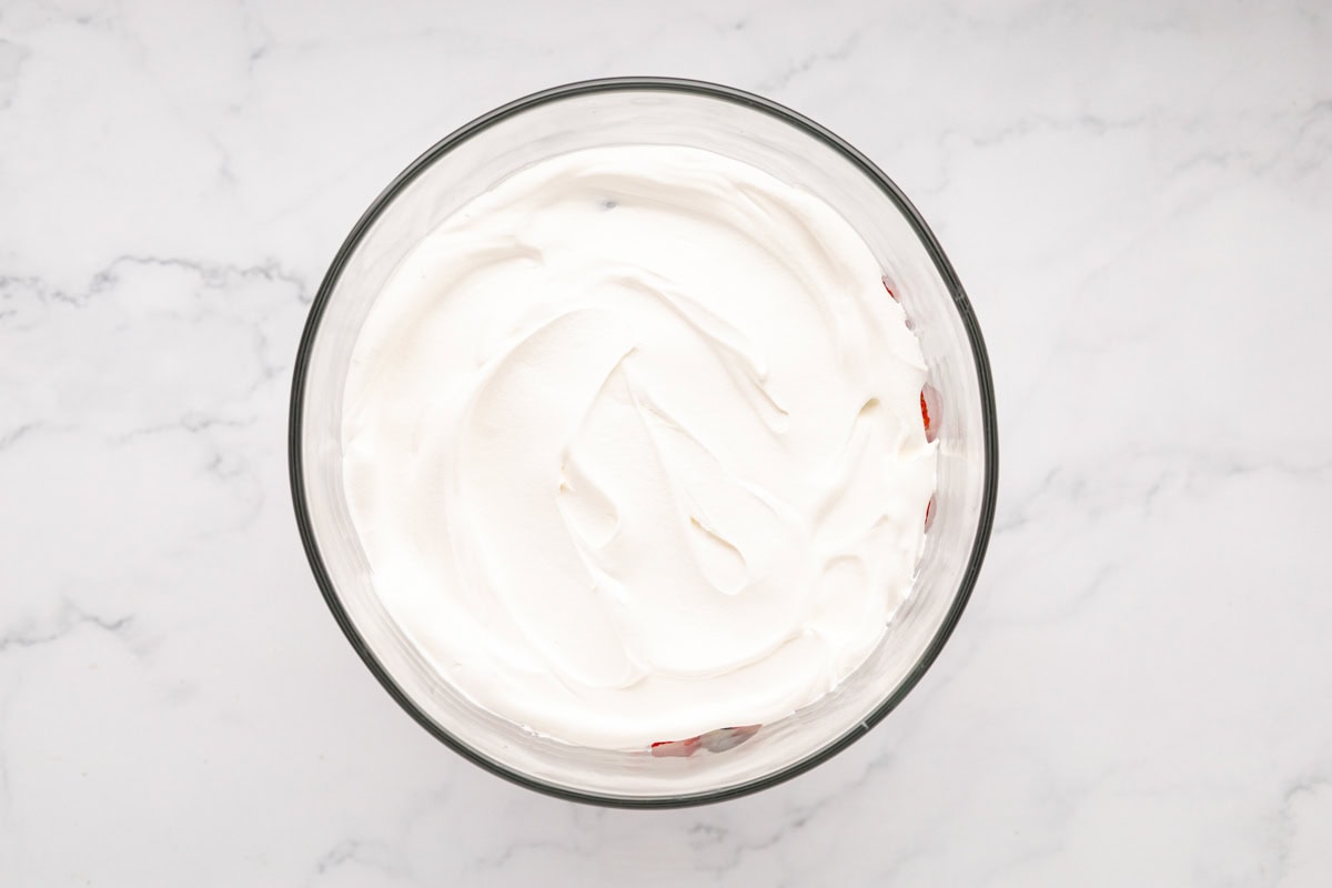 Whipped topping layer added to trifle.