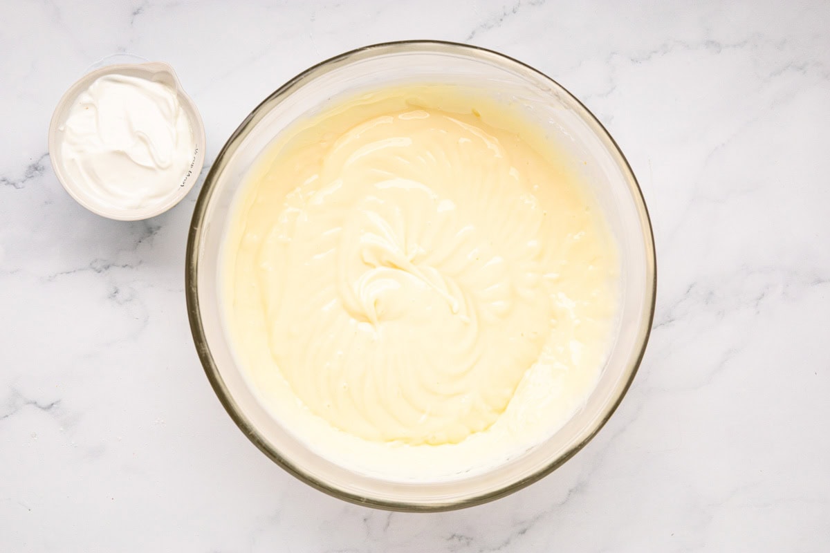 Pudding mixture in a glass bowl.